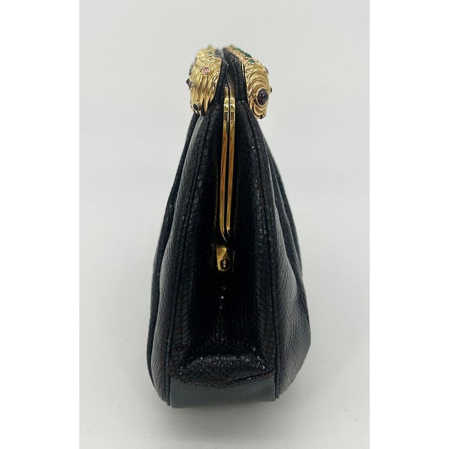 Vintage Judith Leiber Black Lizard Gold Gemstone Top Clutch in fair condition. Black lizard leather exterior trimmed with...