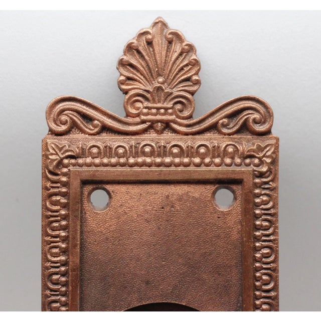 Egg and dart Neoclassical copper over brass pocket door plate in the New York design with keyhole. Matches item #N253928....