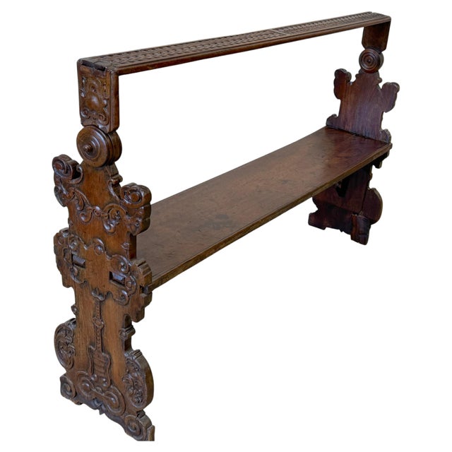 An Italian Baroque carved walnut revolving settle bench, likely Central Italian, dating to the late 17th or early 18th...