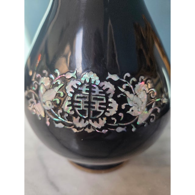 Add a touch of Hollywood Regency elegance to your home with this stunning vintage Chinoiserie vase. Crafted with a brass...