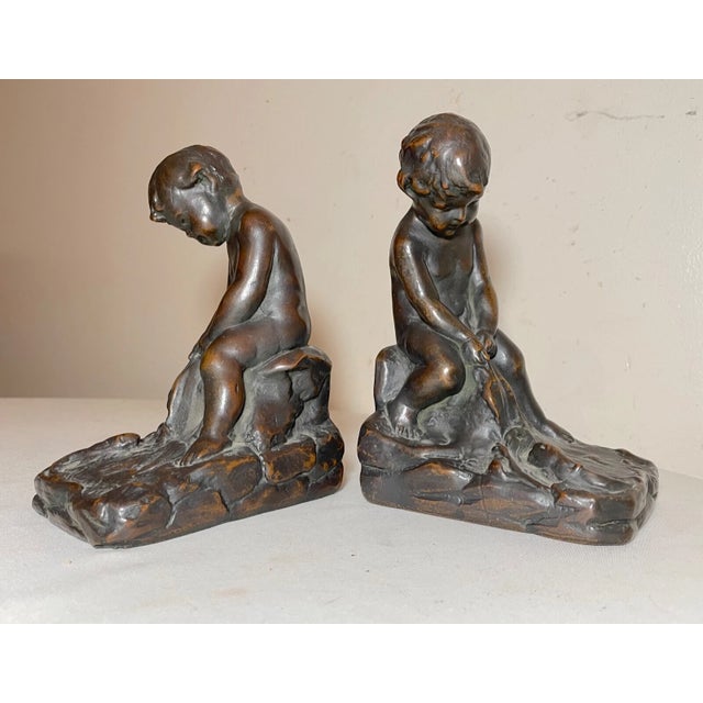 Pair of 2 Antique Patinated Bronze Clad Nude Cherub Boy With Leaf Bookends Set For Sale - Image 9 of 10