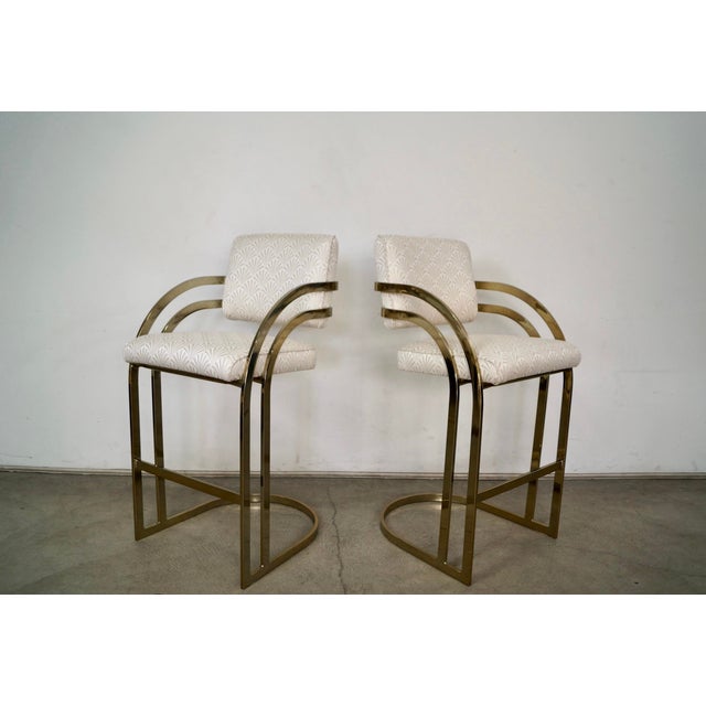 Pair of 1980's Art Deco brass bar stools for sale. These were manufactured by Cal-Style here in LA in 1984, and are in...