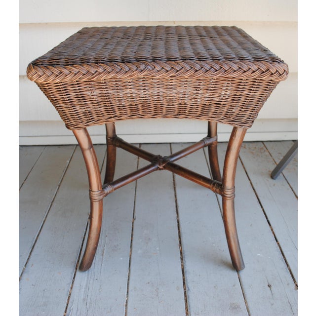 This is a nice sized bamboo accent table. It has bamboo legs, a wicker top with a nice diamond pattern and braided edges....
