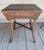 This is a nice sized bamboo accent table. It has bamboo legs, a wicker top with a nice diamond pattern and braided edges....