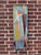 The artwork presents an abstract composition characterized by geometric forms and a vibrant interplay of colors, including...