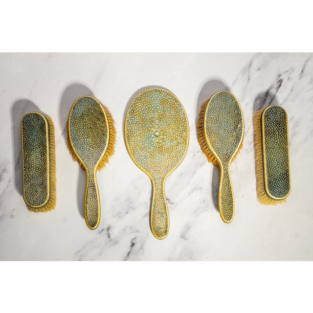 A truly exceptional circa 1920 English shagreen vanity set, this luxurious five-piece dressing ensemble was retailed by...