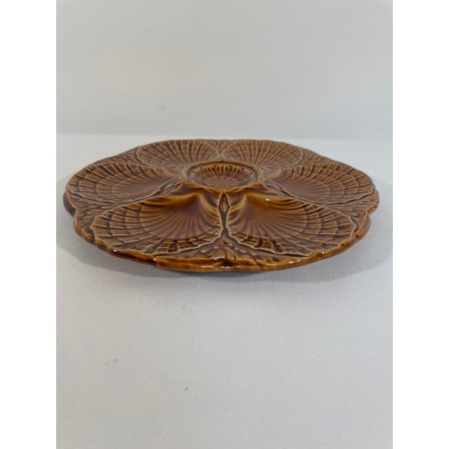 A stunning deep gold/amber French Majolica Sarreguemines Oyster Plate, circa 1920s-30s. Signed Sarreguemines on the back...