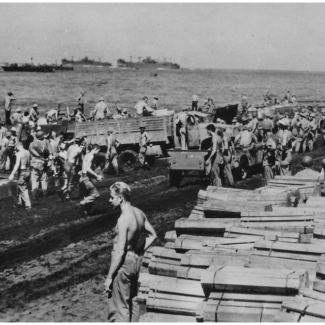 1943 black and white of WW II soldiers from the Buckeye Division loading loading supplies in Bougainville Island....