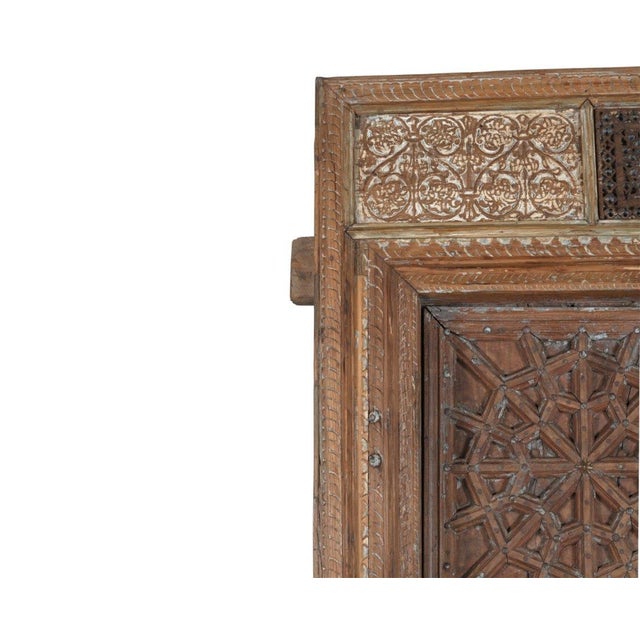 This Antique Indian Carved Teakwood Door with Frame from Punjab,is hand-carved from solid teakwood, featuring an intricate...