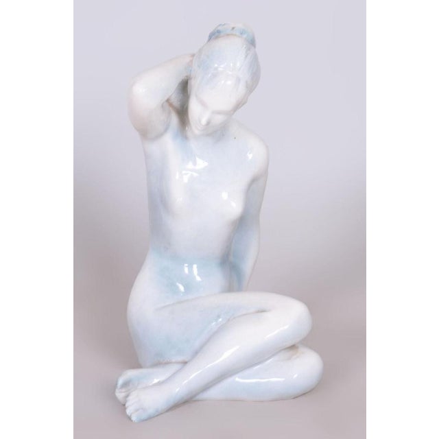 Artist: Bohumil Kokrda This ceramic sculpture depicts an elegant female nude and is a signed work by the prominent...