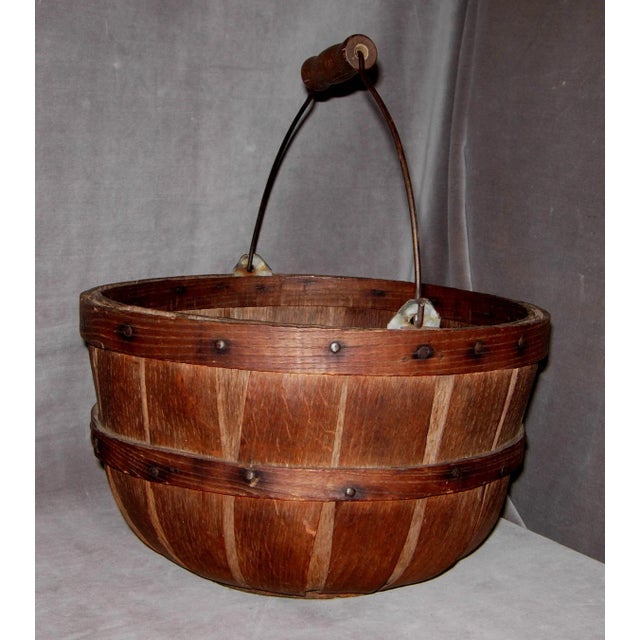Offered here is an Early 1900’s New England “Apple” Gathering Basket. The sturdy bentwood, oak splint basket has a hefty...