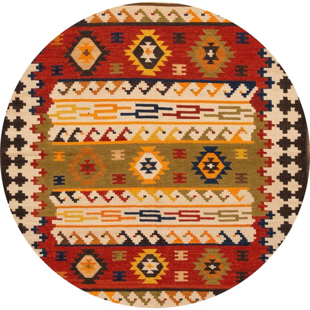 A beautiful hand-woven modern Kilim rug with an ivory field and multi-color accents in an all-over geometric design. This...