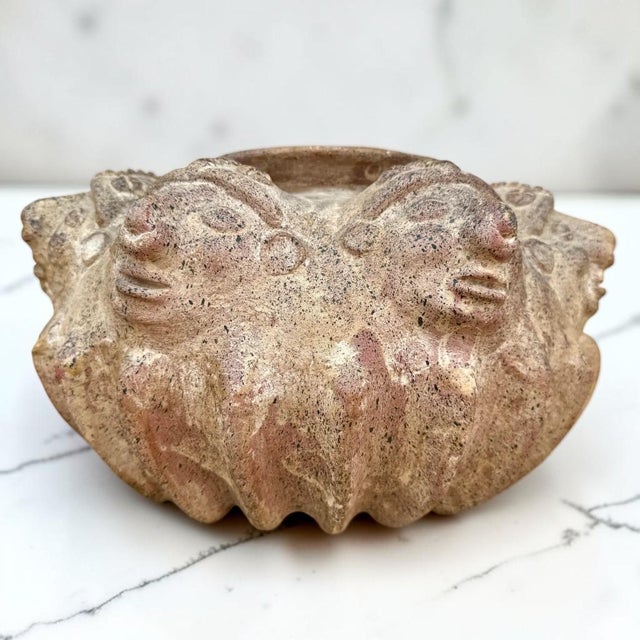 Rare, large antique hand crafted vase with a very detailed and unique design of perpetual faces from the pre-columbian...