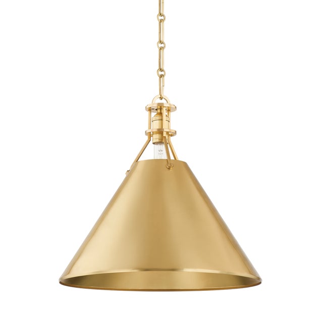 Exposed hardware adds a touch of industrial chic to a timeless cone shade silhouette. Go for a crisp monochromatic look...