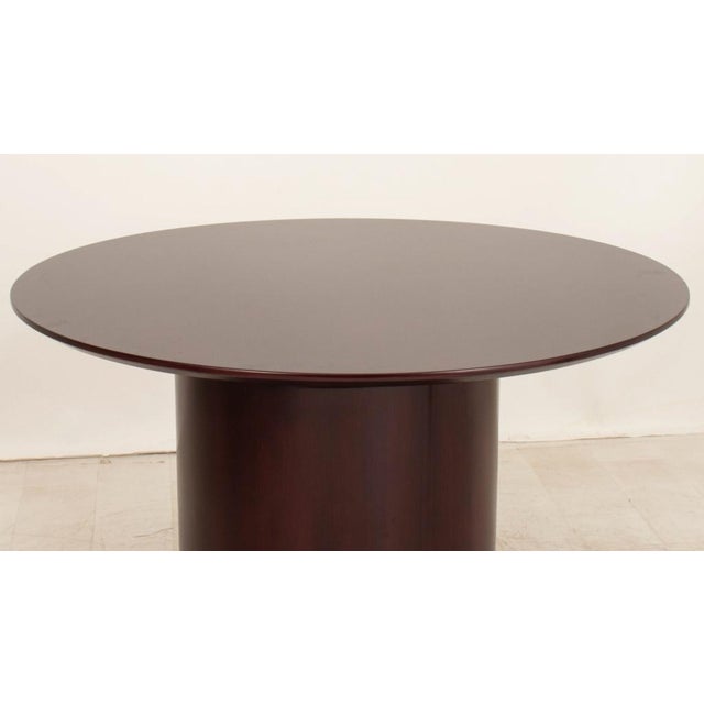 Modern Cherry Stained Round Dining Table, on pedestal base. 29.5" H x 48" Diameter.