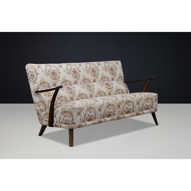 Italian Art Deco Sculptural Walnut Sofa with Original Upholstery, 1930s A striking and highly sculptural Italian Art Deco...