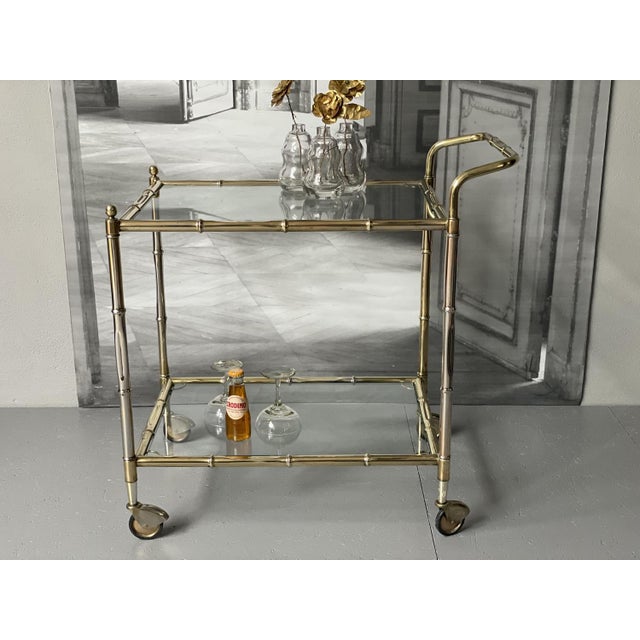 This elegant golden bar cart from 1881, exudes retro charm and timeless sophistication, perfect for elevating your...
