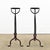 A slender pair of French 18th century wrought and forged iron fireplace andirons. They are Gothic-Mediterranean in style...