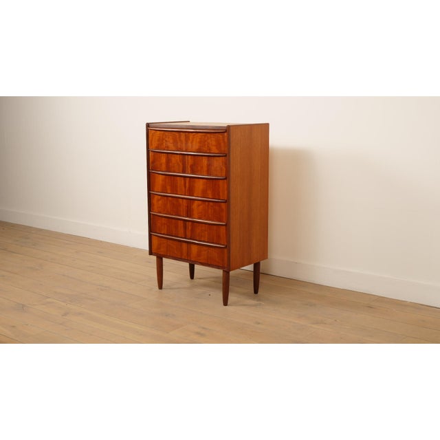 This stylish vintage chest of drawers is a magnificent example of Danish design from the mid-century modern period....