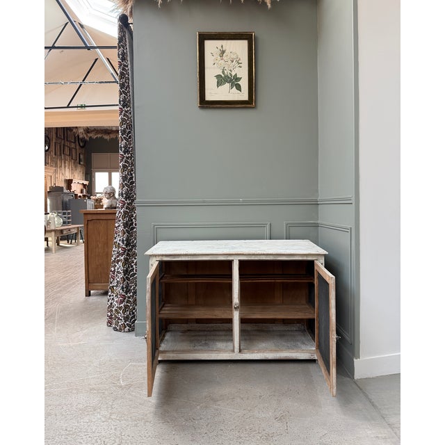 This vintage pantry from the 1950s-60s has retained its original white patina and wire mesh panels. A simple and...
