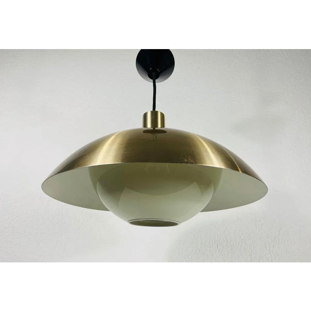 Danish plastic pendant lamp made in denmark in the 1960s. The fixture gives a very beautiful light. It is made from thin...