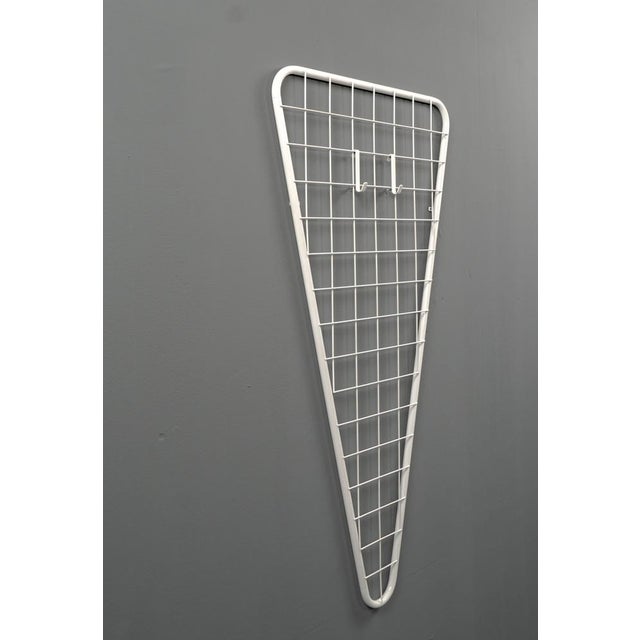 The wardrobe is made of thick metal and an internal wire mesh design. The clothes and jackets can be hung individually....