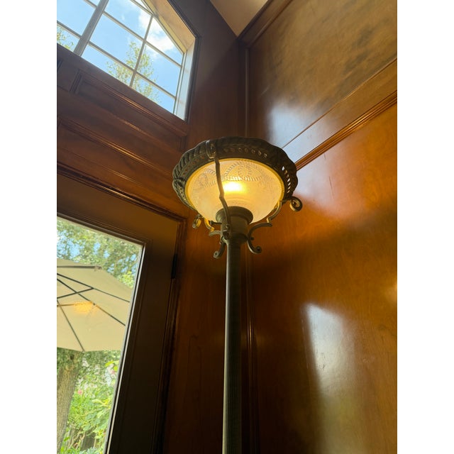 Add timeless elegance to your home with this beautiful traditional torchiere floor lamp featuring an ornate bronze-tone...