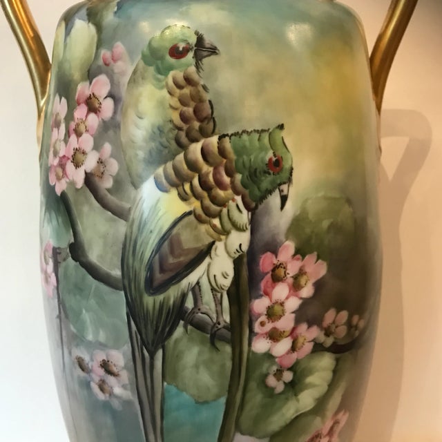 A Oscar and Edgar Gutherz Royal Austria Art Nouveau vase. Feature an overall verdant motif with parrots perched atop...