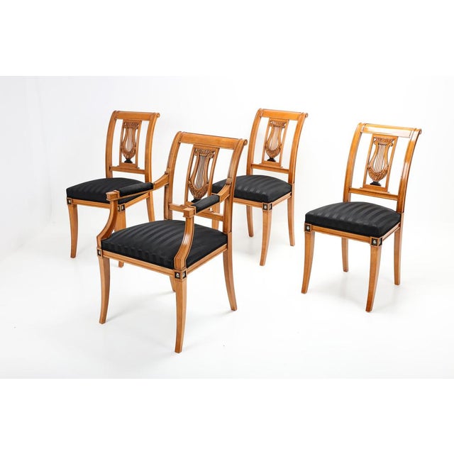 An extraordinary collection of 12 chairs around 1900, 2 of which are equipped with armrests, which are suitable for...