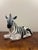 Charming 1950s Italian ceramic zebra sculpture, beautifully modeled in a relaxed reclining pose and finished with bold...