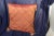 Late 20th c. down argyle pattern pillow. The piece is an burnt orange/copper color.