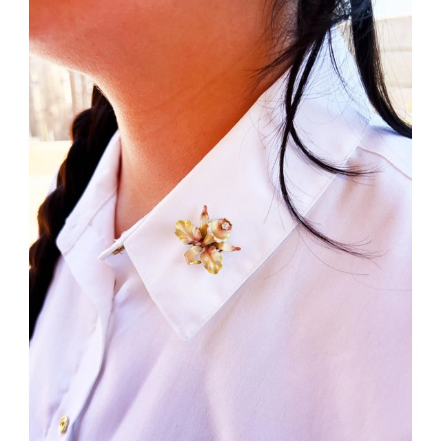 About This Brooch: This exquisite late Victorian Orchid brooch by Whiteside & Blank features delicate pink, green, and...