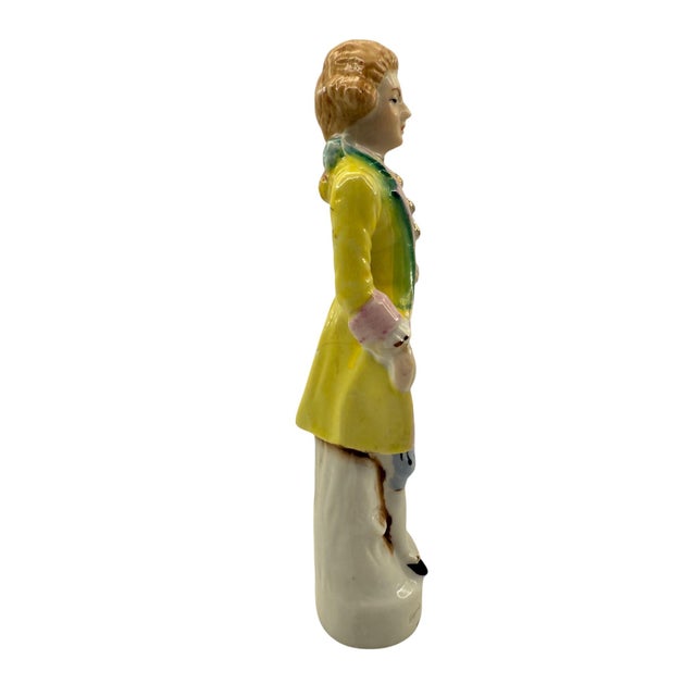 Japanese Colonial Man Figurine This elegantly dressed gentleman appears to be mid step. He is wearing a yellow coat with...