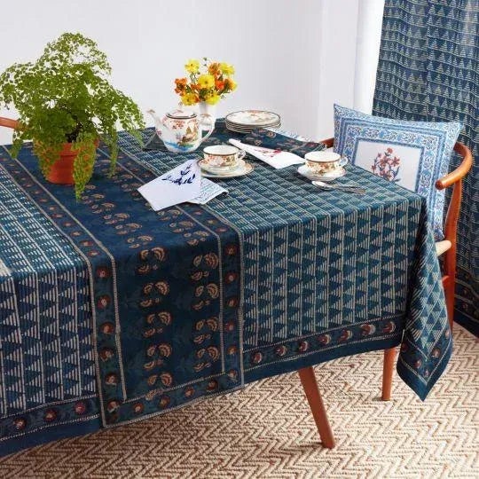 The Delta pattern features a striped triangular pattern in off-white and light indigo set against a deep indigo blue...