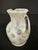 This vintage hand-blown glass pitcher is crafted in luminous opaline glass and stands approximately 4.5 inches high. The...