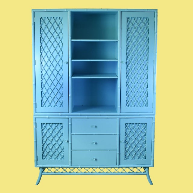 A vintage Ficks Reed blue breakfront, a rare and coveted piece with beautiful woven texture and a rich blue finish. The...