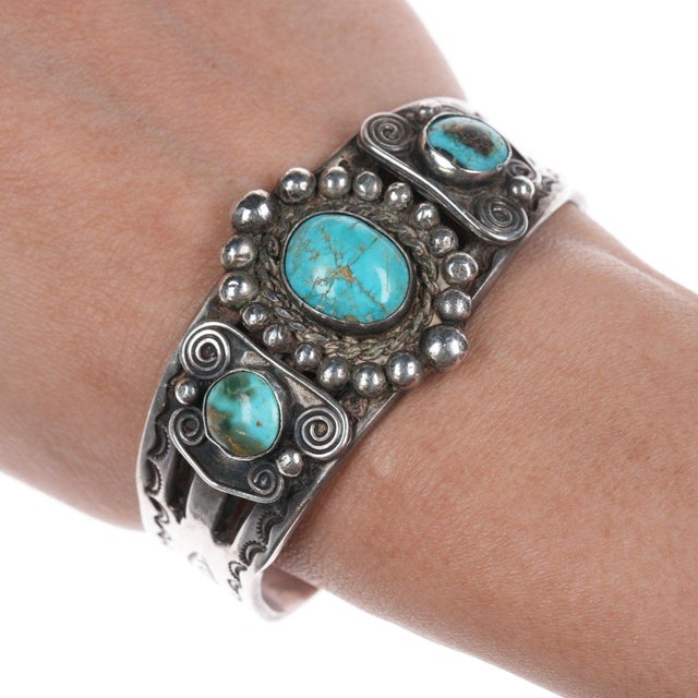 6 3/8" c1940's-50's Navajo Stamped silver bracelet with turquoise 32mm wide in<br>center, old/stable fracture in...