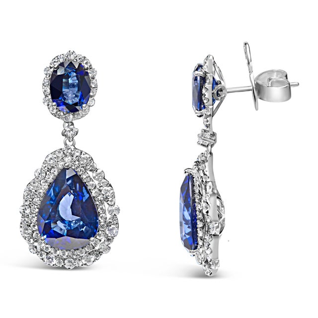 Adorn your ensemble with the sophistication of these 18K white gold earrings, featuring diffused blue sapphires accented...