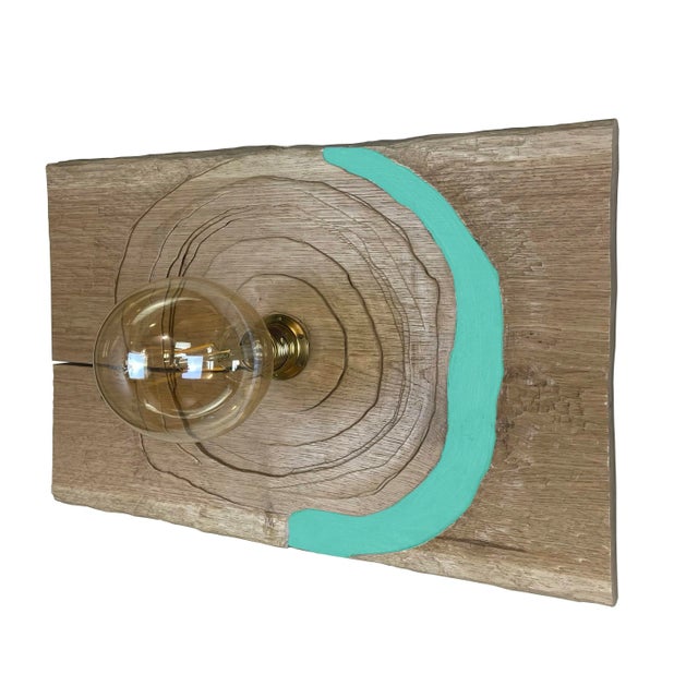 "Trottola Verde" lamp by Pietro Meccani. Beautiful hand-carved oak wall lamp with colored accents. Designed in 1996, it is...