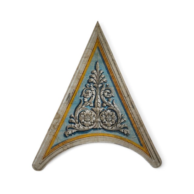 A pair of painted Florentine pendentives. Their classical details evoke Renaissance designs, lending sophistication to the...