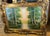 Bring the beauty of nature into your home with this grand landscape wall art, featuring a serene woodland scene framed by...