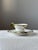 Porcelain cup and saucer by Königliche Porzellan-Manufaktur Berlin (KPM), decorated with a hand-painted ivy motif. The...