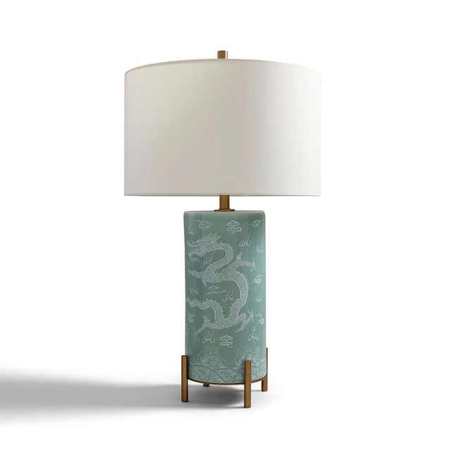 Imperial Dragon is our transitional lamp which features a crackled celadon glaze background with white colored dragon...
