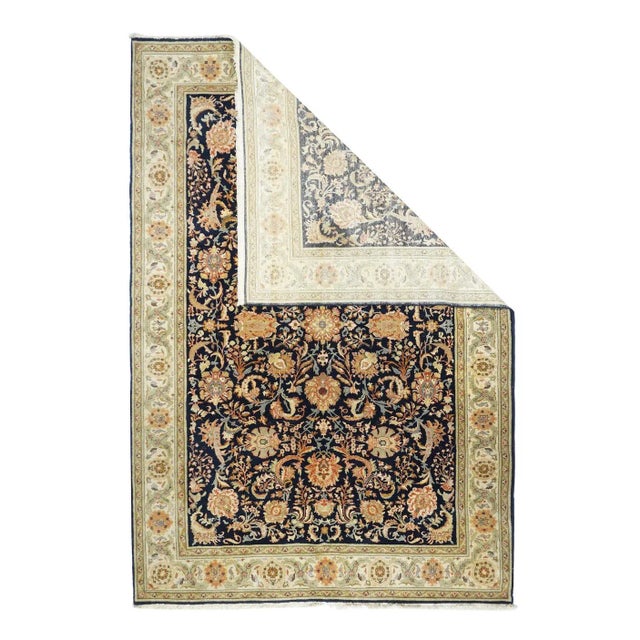 The near black field shows an allover pattern of lazy and petal palmettes, flowering palmettes, long barbed leaves and...