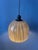 Unique mid-century pendant light by Peill & Putzler. The thick glass shade features a beautiful swirl pattern that creates...