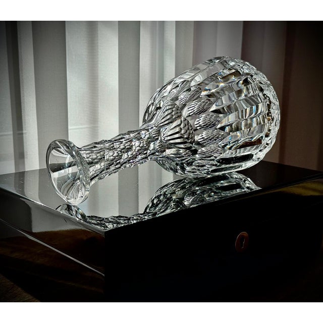 An Edwardian cut-glass sherry decanter, made in England around 1905. The piece features a rounded hand-blown body with...
