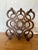 Sleek mid-century walnut wine rack by Kustom Kraft, circa 1960s. Features a sculptural nine-bottle configuration of...