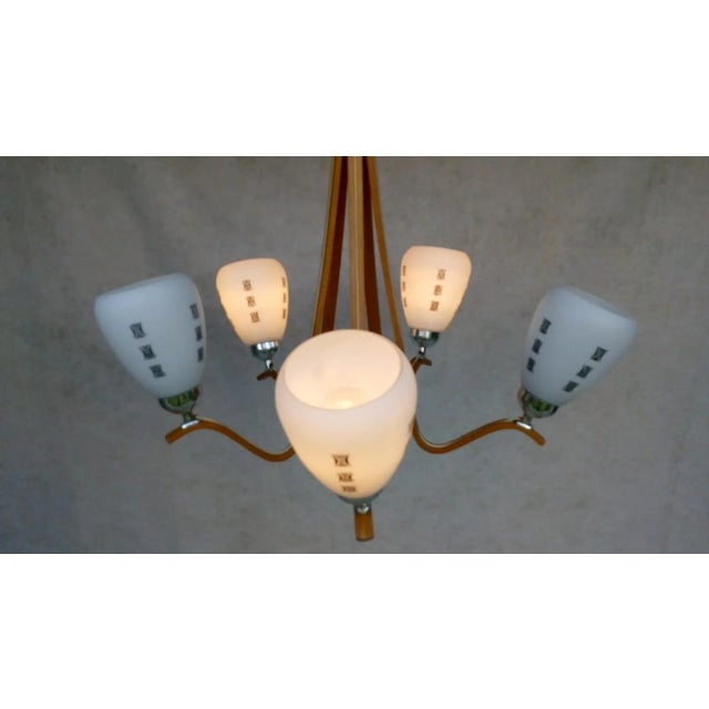 Beautiful, authentic, very well preserved retro vintage chandelier, type - v 3/5. It has a beech wood holder. It has 5...