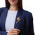 This striking Retro flower brooch showcases a vibrant arrangement of 24 square, round brilliant, and cushion cut rubies...