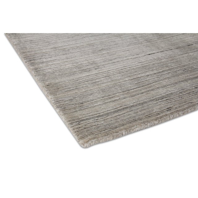 Bring a sense of harmony and balance to any setting with the Banburr Rug. The soft textured pile and beautiful linear,...